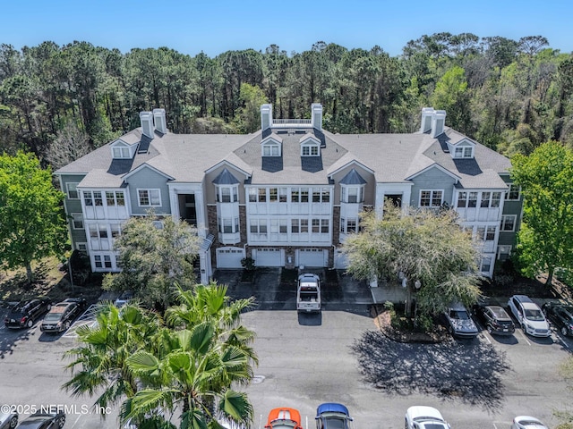 aerial view featuring a wooded view