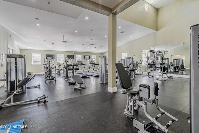 exercise room featuring recessed lighting and baseboards