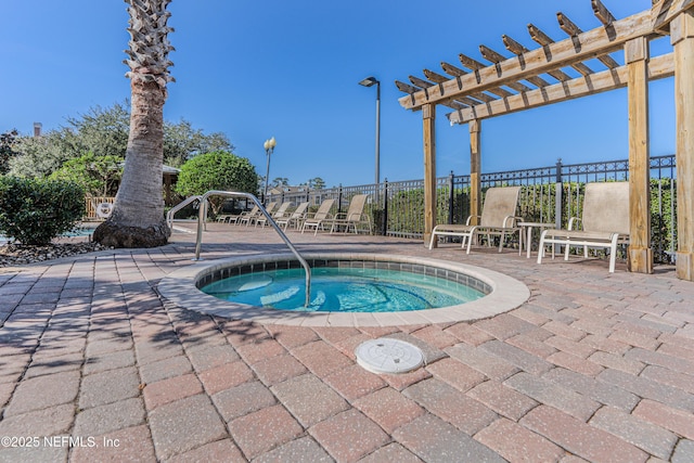 view of swimming pool with a patio area, fence, a pergola, and a hot tub