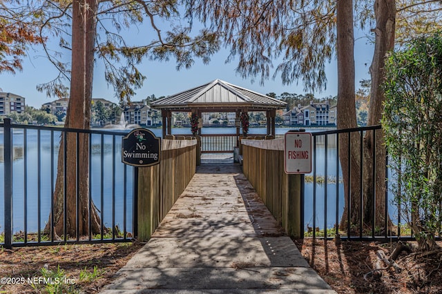 surrounding community featuring a gazebo and a water view