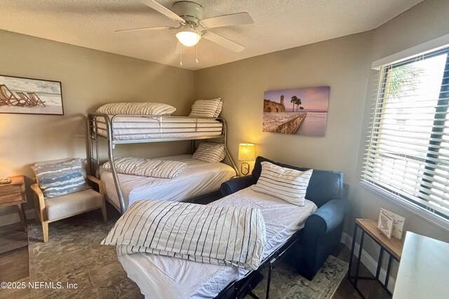 4250 A1A S Unit E26, Saint Augustine, FL 32080 - bedroom featuring a textured ceiling and a ceiling fan