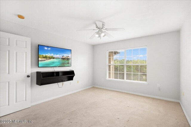 10961 Burnt Mill Rd Unit 1135, Jacksonville, FL 32256 - unfurnished living room with carpet flooring, baseboards, and ceiling fan