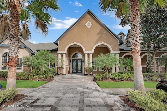 10961 Burnt Mill Rd Unit 1135, Jacksonville, FL 32256 - view of front facade featuring french doors and stucco siding