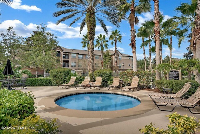 10961 Burnt Mill Rd Unit 1135, Jacksonville, FL 32256 - view of swimming pool with fence and a hot tub