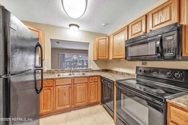 8880 Old Kings Rd S Unit 84, Jacksonville, FL 32257 - kitchen featuring light tile patterned flooring, a sink, black appliances, a textured ceiling, and a textured wall