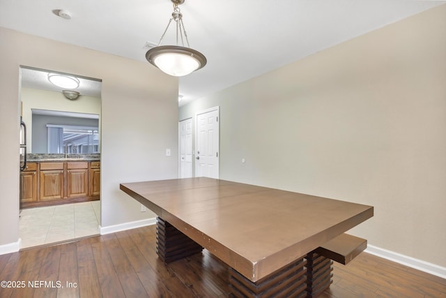 8880 Old Kings Rd S Unit 84, Jacksonville, FL 32257 - unfurnished dining area with light wood-type flooring, baseboards, and a sink