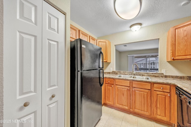 8880 Old Kings Rd S Unit 84, Jacksonville, FL 32257 - kitchen with light tile patterned flooring, a textured ceiling, black appliances, and a sink