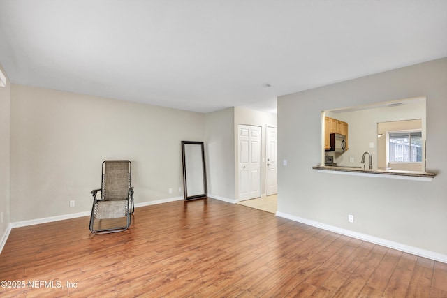 8880 Old Kings Rd S Unit 84, Jacksonville, FL 32257 - sitting room featuring baseboards and light wood-style flooring