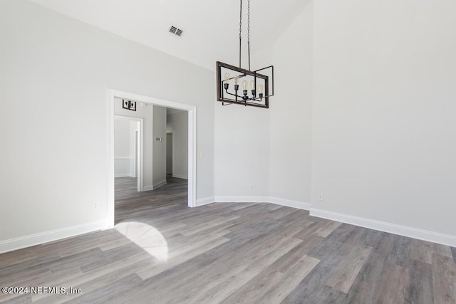 2619 Wrightson Dr, Jacksonville, FL 32223 - unfurnished dining area featuring a chandelier, wood finished floors, visible vents, and baseboards