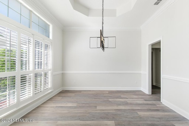 2619 Wrightson Dr, Jacksonville, FL 32223 - unfurnished dining area with a wealth of natural light, ornamental molding, and wood finished floors