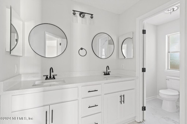 2619 Wrightson Dr, Jacksonville, FL 32223 - full bathroom with double vanity, marble finish floor, toilet, and a sink