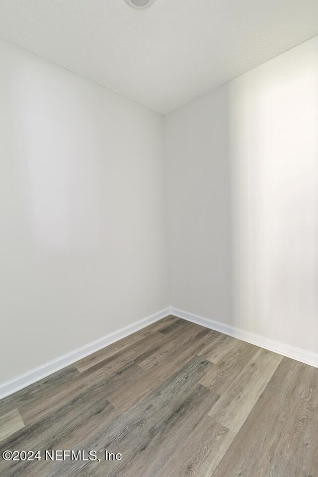 2619 Wrightson Dr, Jacksonville, FL 32223 - unfurnished room with wood finished floors and baseboards