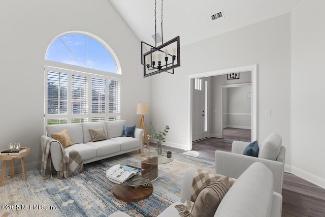 2619 Wrightson Dr, Jacksonville, FL 32223 - living area featuring high vaulted ceiling, baseboards, a chandelier, and visible vents