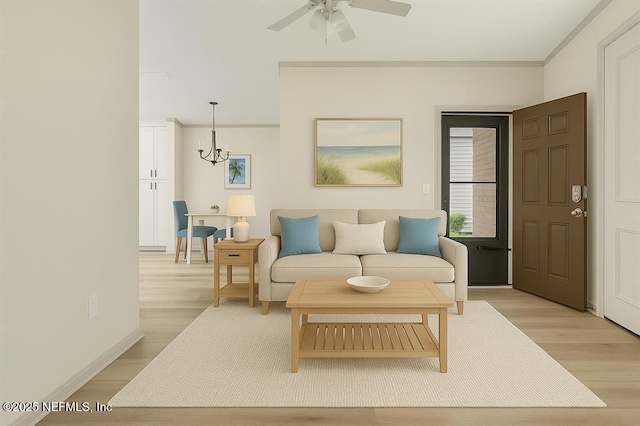 1601 Nectarine St Unit B2, Fernandina Beach, FL 32034 - living room with light wood-type flooring, ceiling fan, ornamental molding, a chandelier, and baseboards