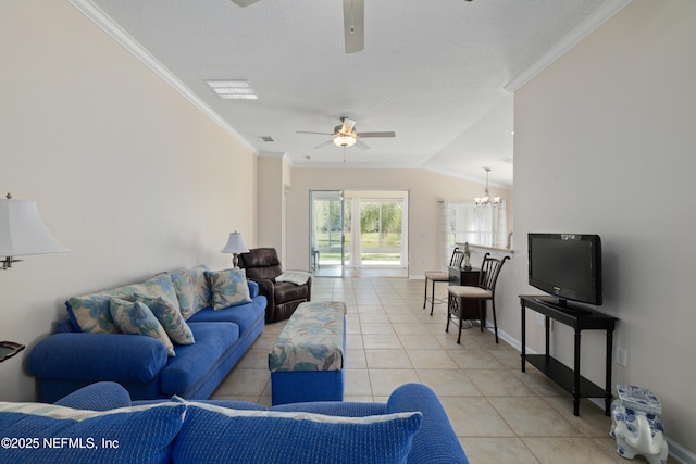 living room featuring ornamental molding, ceiling fan with notable chandelier, light tile patterned floors, baseboards, and vaulted ceiling