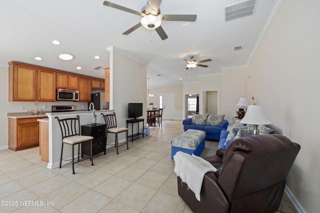 living area with visible vents, ceiling fan, and ornamental molding