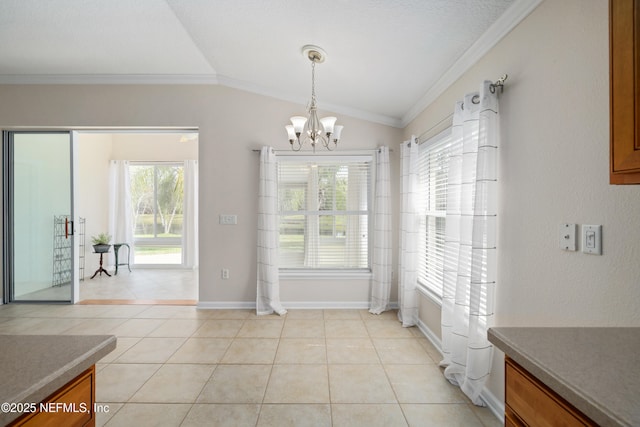 dining space featuring light tile patterned floors, baseboards, ornamental molding, vaulted ceiling, and a chandelier
