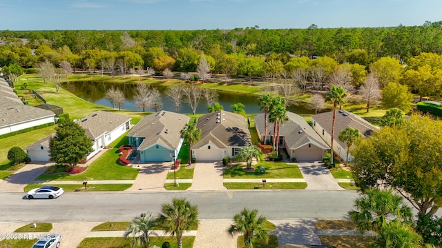 bird's eye view with a residential view, a forest view, and a water view