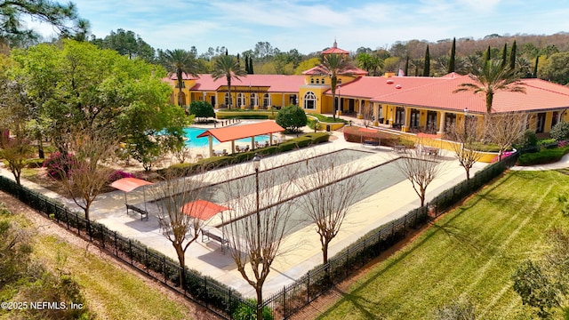 exterior space featuring a lawn and fence