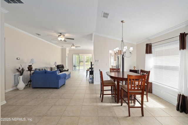 dining room featuring light tile patterned floors, visible vents, and ornamental molding