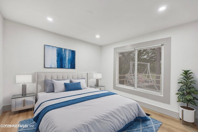 6099 Milligan Rd, Keystone Heights, FL 32656 - bedroom with recessed lighting, baseboards, and wood finished floors