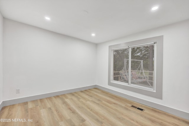 6099 Milligan Rd, Keystone Heights, FL 32656 - empty room with recessed lighting, visible vents, baseboards, and wood finished floors