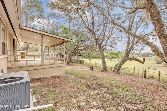 6099 Milligan Rd, Keystone Heights, FL 32656 - view of yard featuring a deck, fence, and central AC