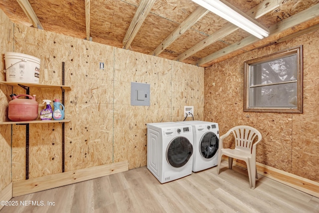 6099 Milligan Rd, Keystone Heights, FL 32656 - clothes washing area featuring electric panel, washing machine and dryer, and wood finished floors