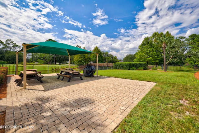 view of patio / terrace with area for grilling and fence