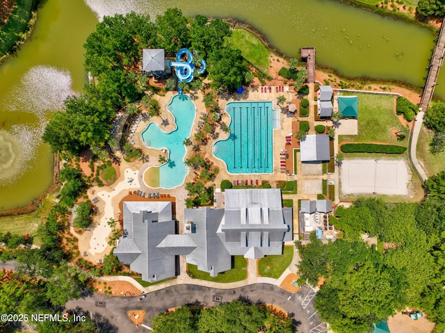birds eye view of property with a water view