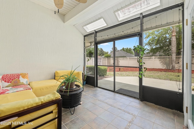 sunroom with outdoor lounge area, a skylight, beamed ceiling, and ceiling fan