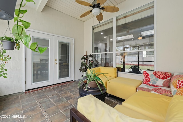 exterior space with an outdoor living space and ceiling fan