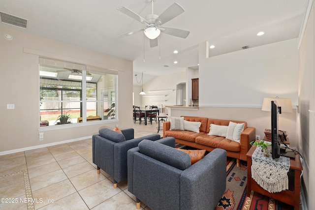 living area with light tile patterned flooring, a ceiling fan, visible vents, and recessed lighting