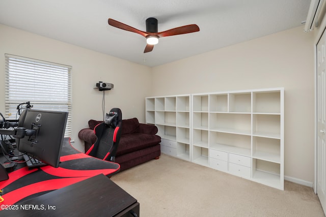 carpeted home office featuring a ceiling fan
