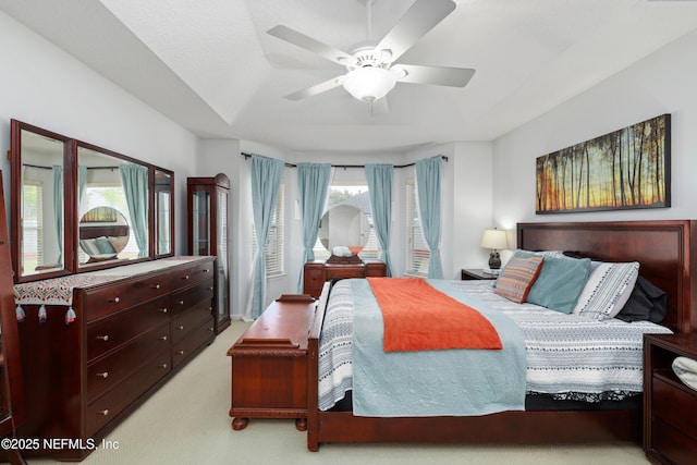 bedroom with ceiling fan and carpet floors