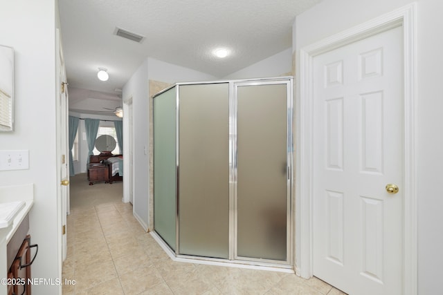 bathroom featuring visible vents, connected bathroom, a stall shower, and vanity
