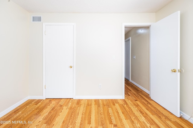 8331 Pineverde Ln, Jacksonville, FL 32244 - unfurnished bedroom featuring light wood-type flooring, visible vents, and baseboards