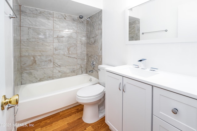 8331 Pineverde Ln, Jacksonville, FL 32244 - full bath featuring vanity, toilet, shower / bathtub combination, and wood finished floors