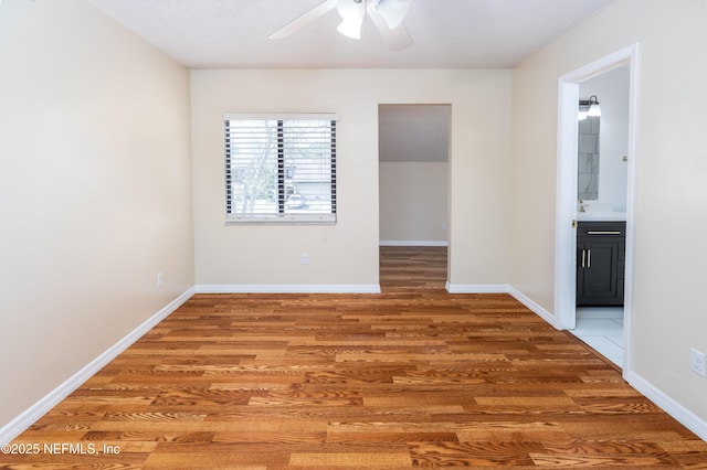8331 Pineverde Ln, Jacksonville, FL 32244 - unfurnished room featuring light wood-type flooring, baseboards, and a ceiling fan