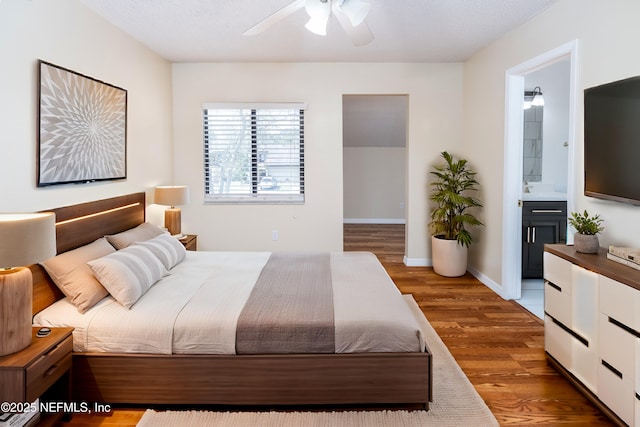 8331 Pineverde Ln, Jacksonville, FL 32244 - bedroom featuring ceiling fan, ensuite bathroom, baseboards, and wood finished floors
