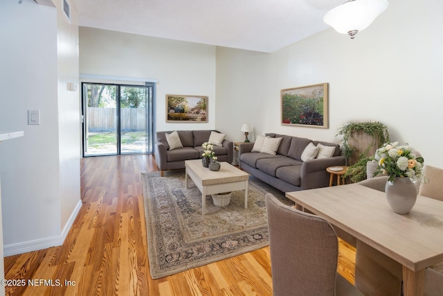 8331 Pineverde Ln, Jacksonville, FL 32244 - living room with visible vents, baseboards, and light wood-style floors