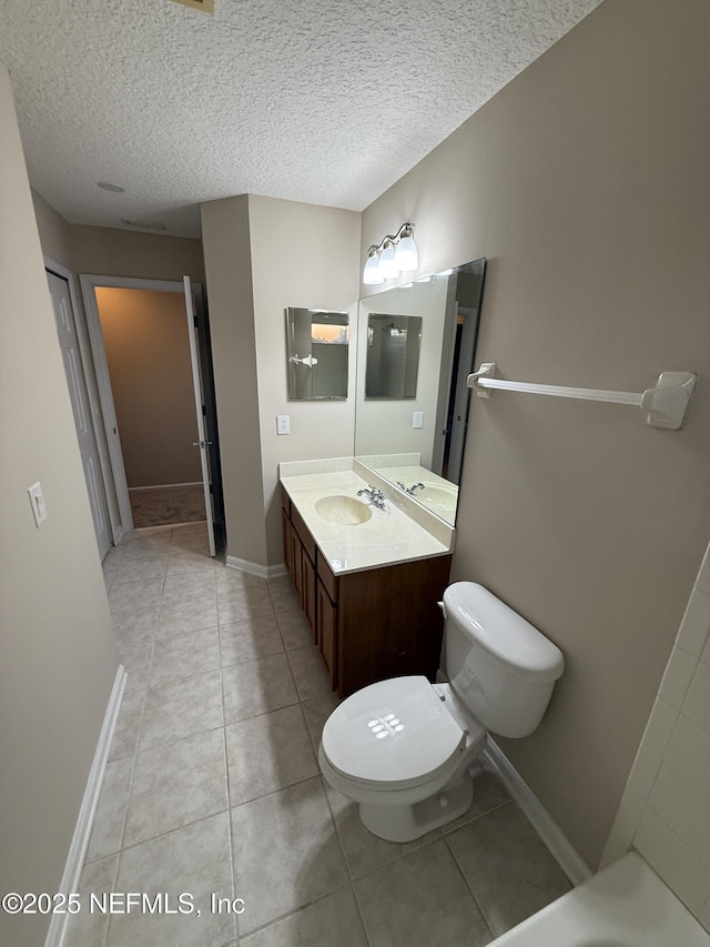 3549 Victoria Lakes Dr W, Jacksonville, FL 32226 - bathroom featuring tile patterned flooring, a textured ceiling, and vanity