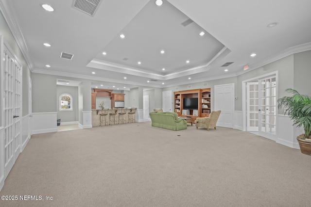 10075 Gate Pkwy Unit 1301, Jacksonville, FL 32246 - unfurnished room with visible vents, a raised ceiling, light carpet, and crown molding