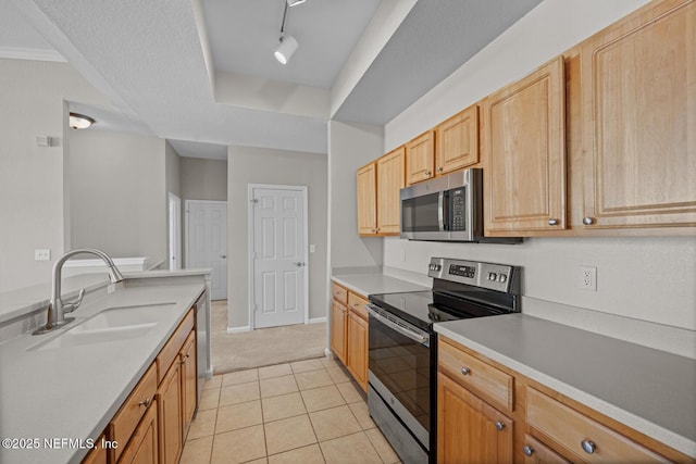10075 Gate Pkwy Unit 1301, Jacksonville, FL 32246 - kitchen featuring light tile patterned floors, stainless steel appliances, light countertops, and a sink