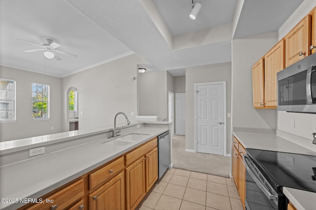 10075 Gate Pkwy Unit 1301, Jacksonville, FL 32246 - kitchen featuring ceiling fan, light countertops, appliances with stainless steel finishes, light tile patterned flooring, and a sink