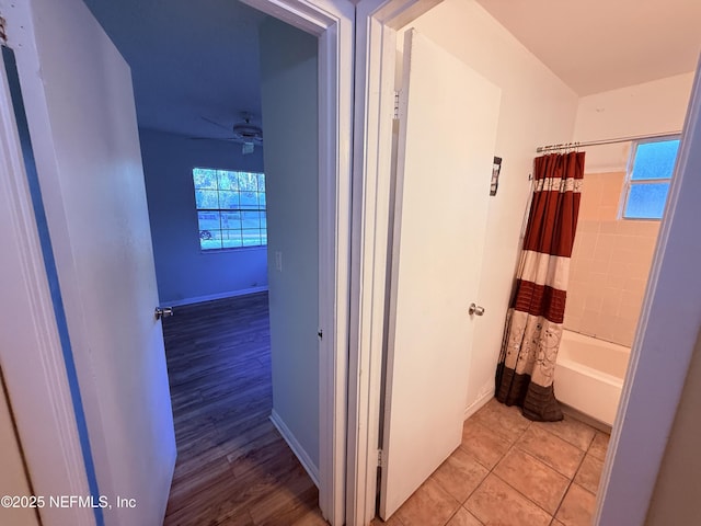 bathroom with wood finished floors, baseboards, and ceiling fan