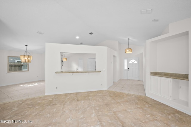 unfurnished living room featuring visible vents, vaulted ceiling, light tile patterned floors, baseboards, and a chandelier