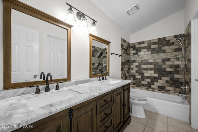 full bathroom with tile patterned flooring, a sink, lofted ceiling, and shower / bathing tub combination