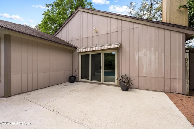 rear view of house featuring a patio