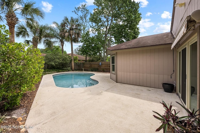 view of swimming pool featuring a patio, a fenced backyard, and a fenced in pool